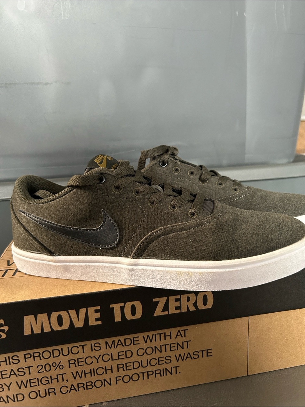 Nike SB Check Solar Canvas Premium in an olive/cargo green colorway.